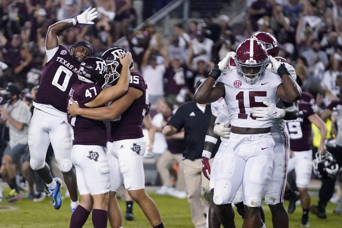Texas A&M's Seth Small (47) celebrates with teammates after making a game-winning field goal Oct. 9, 2021.
