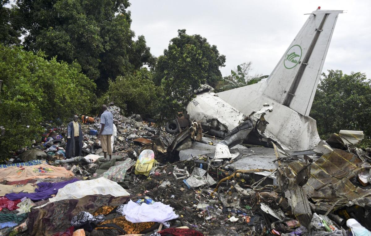 Responders pick through the wreckage of a cargo plane that crashed after takeoff in Juba, the capital of South Sudan.