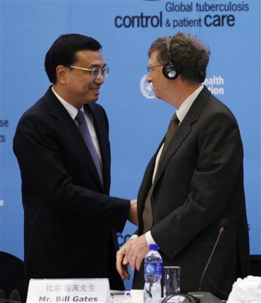 Bill Gates, right, the co-founder of the Bill and Melinda Gates Foundation, chats with Chinese Vice Premier Li Keqiang at the opening ceremony of a three-day meeting on drug-resistant Tuberculosis in Beijing Wednesday, April 1, 2009. WHO Director-General Margaret Chan told health ministers and senior officials from 27 countries Wednesday that emerging, hard-to-treat strains of tuberculosis are set to spiral out of control and urged countries to fight the growing threat to global public health. (AP Photo/ Elizabeth Dalziel)
