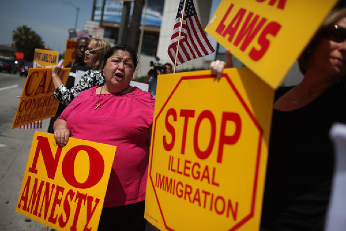 Protesters gathered in front of Sen. Dianne Feinstein's Sawtelle office to voice opposition to a path to citizenship for unauthorized immigrants.