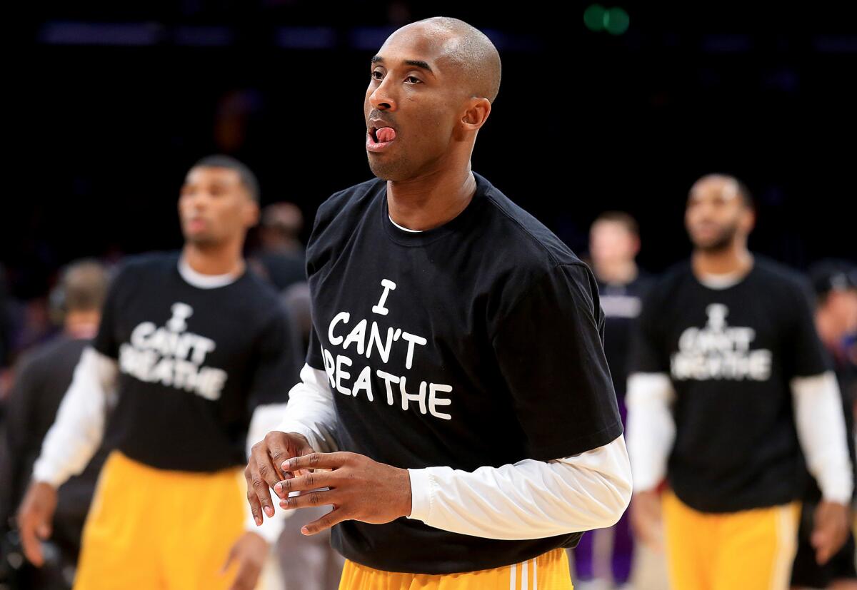 LOS ANGELES, CALIF. - DEC. 9, 2014. Kobe Bryant and other lakers wear "I Can't Breathe" T-shirts while warming up for the game against the Kings on Tuesday, Dec. 9, 2014, at Staples Center in Los Angeles. (Luis Sinco/Los Angeles Times)