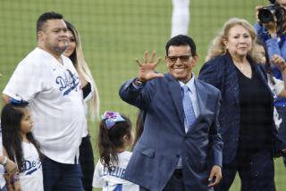 LOS ANGELES, CA - AUGUST 11: Sounded by family Fernando Valenzuela waves to the fans.