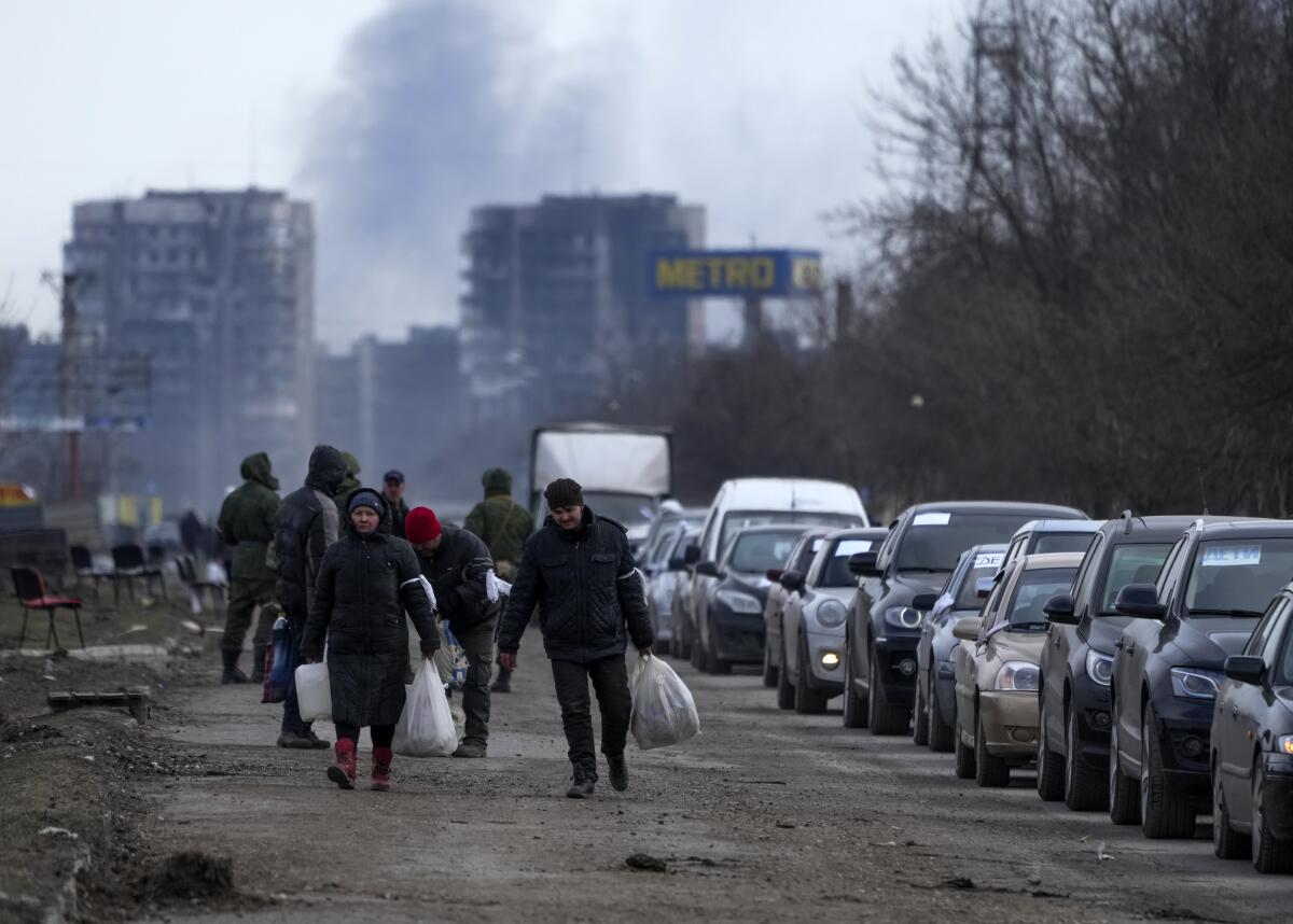Civilians evacuate the city of Mariupol in Ukraine.