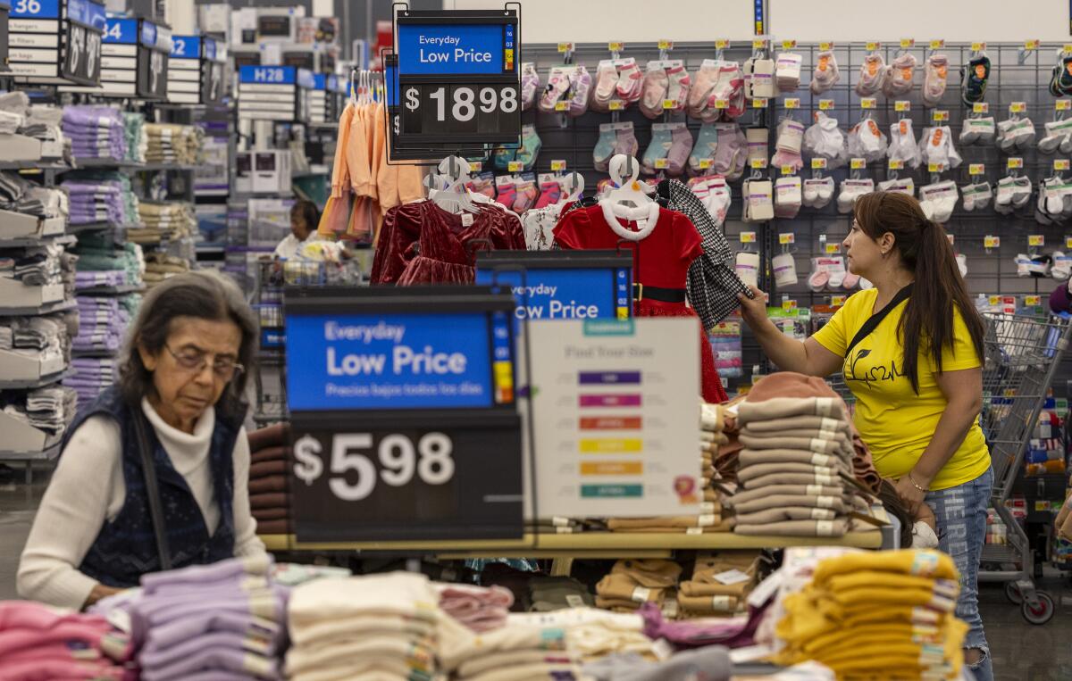 Shoppers look over clothing items at the Walmart Supercenter in Burbank