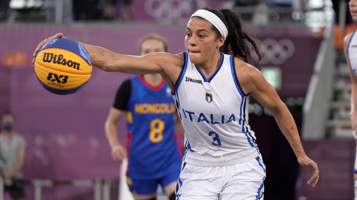 Italy's Rae Lin D'Alie, of Wisconsin, plays 3-on-3 basketball at the Tokyo Olympics