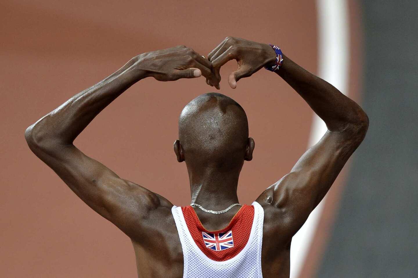 British sprinter Mo Farah sports a beaded Union Jack bracelet to go with the one on the back of his uniform.