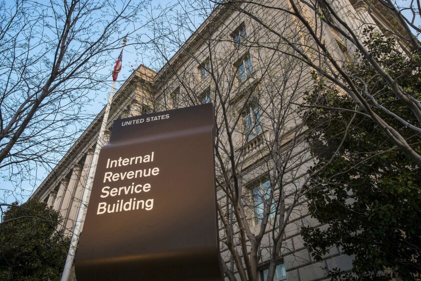 FILE - This April 13, 2014, file photo, shows the Internal Revenue Service headquarters building in Washington. A federal judge says it's likely that Microsoft was trying to avoid or evade paying U.S. taxes and is ordering the company to hand over financial documents from more than a decade ago. (AP Photo/J. David Ake, File)