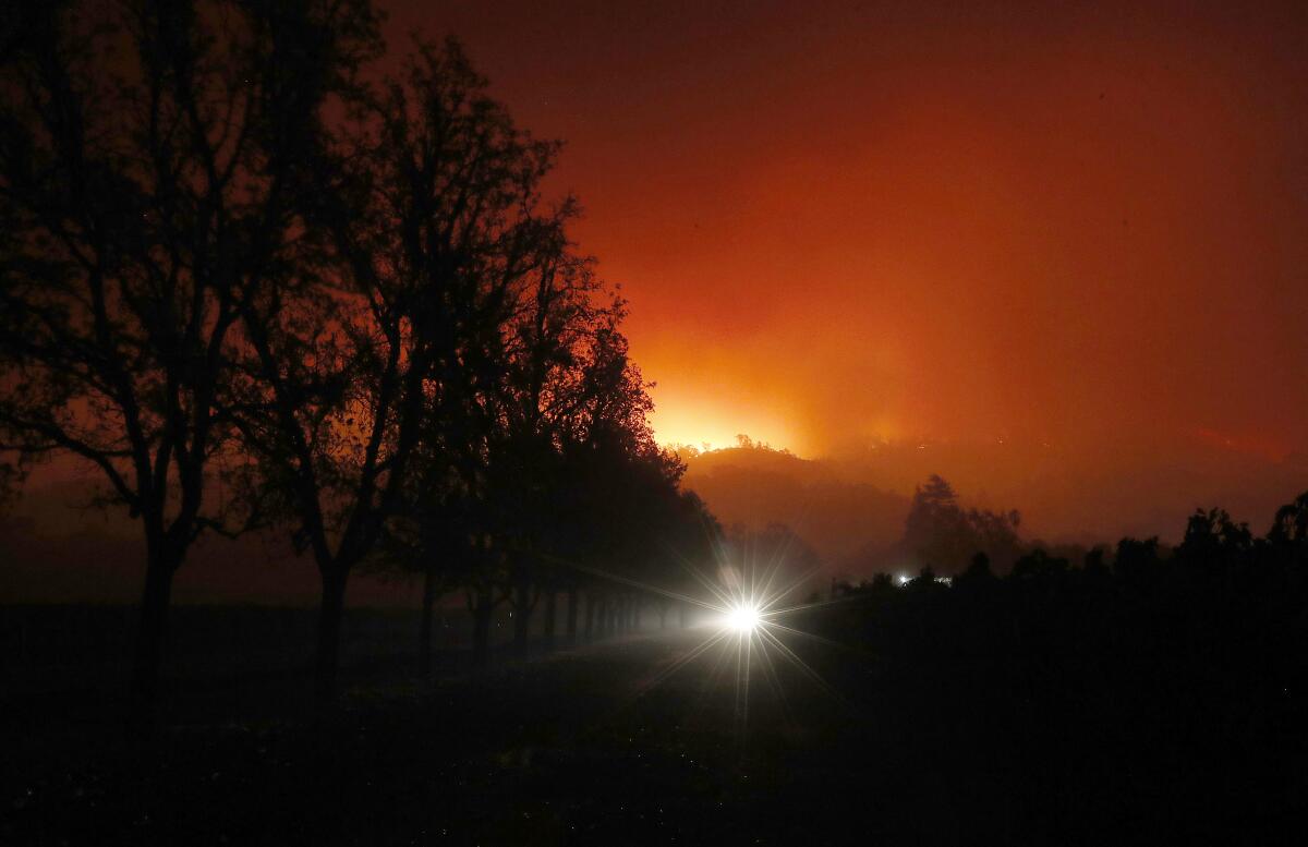 HEALDSBURG, CALIF. - OCT. 26, 2019. Thd KIncade fire burns into the night in the foothills along State Highway 128 near Healdsburg is consumed by the Kincade fire early Sunday morning, Oct. 27, 2019. (Luis Sinco/Los Angeles Times)