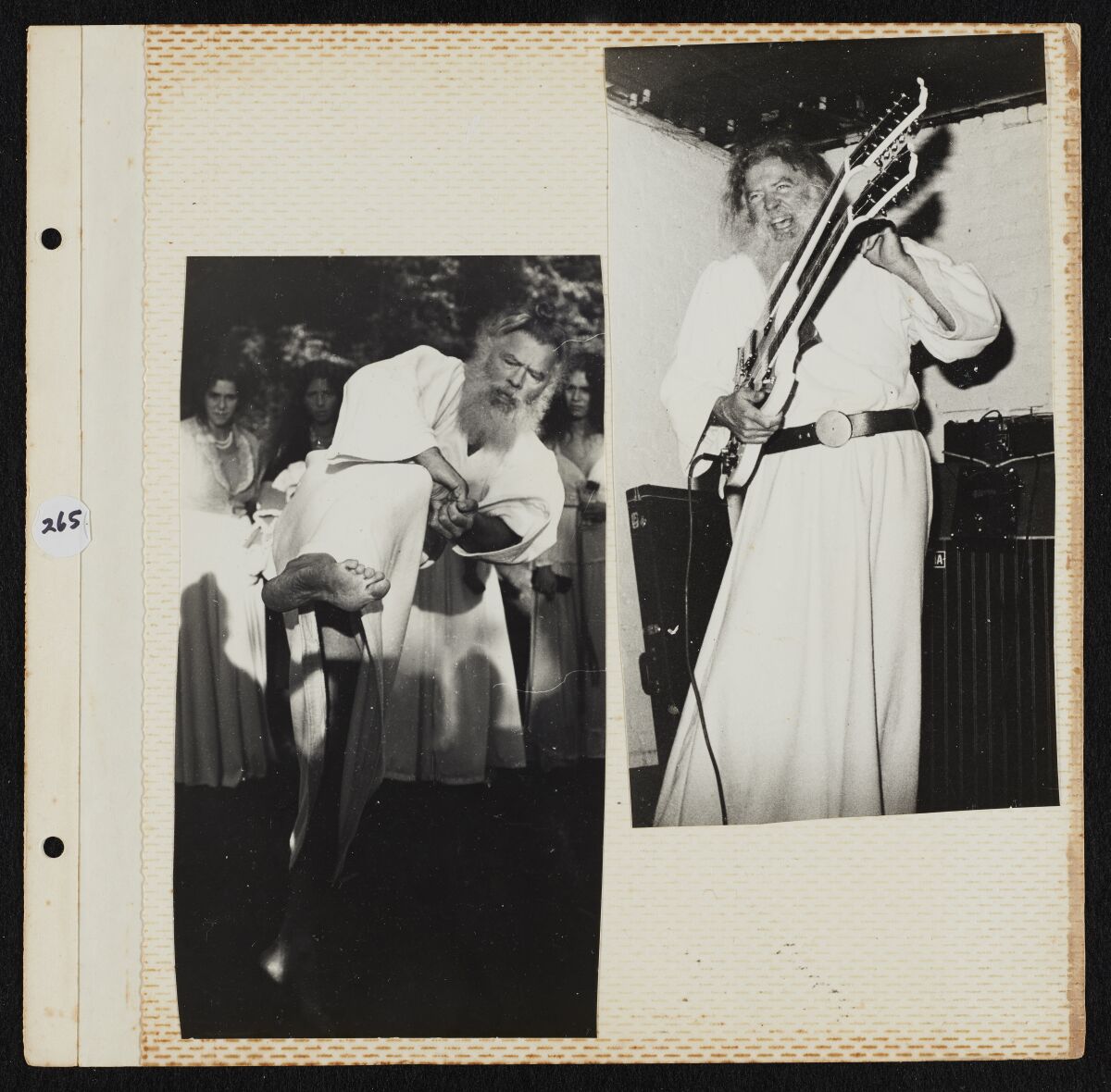 A man in a long white robe demonstrating judo and playing guitar.