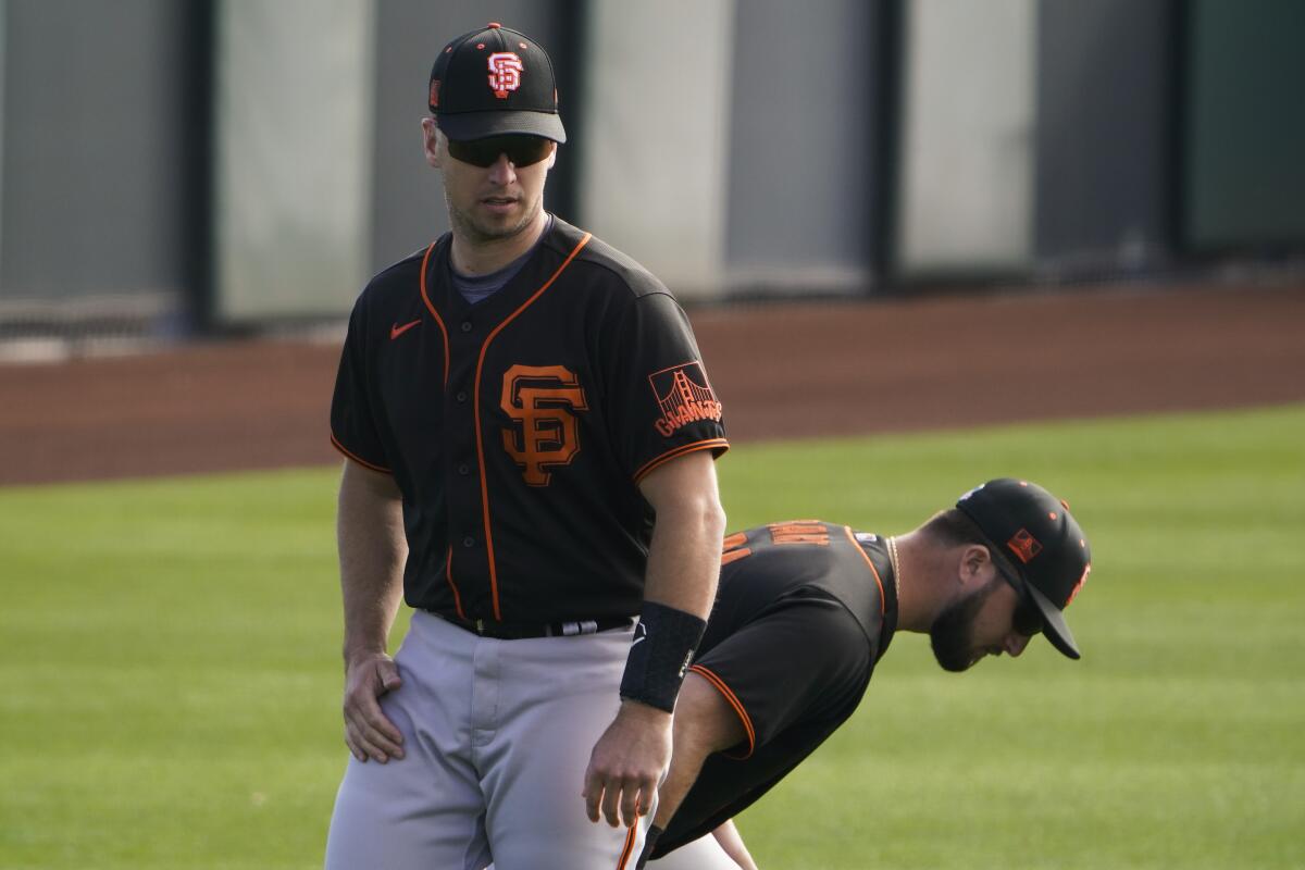 The Giants' Buster Posey, left, and Joey Bart 