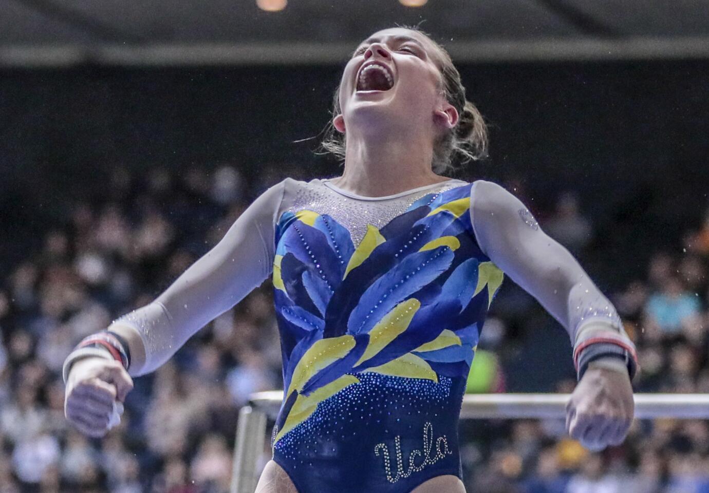 UCLA's Norah Flatley celebrates after finishing her bars routine at the Collegiate Challenge gymnastics meet.
