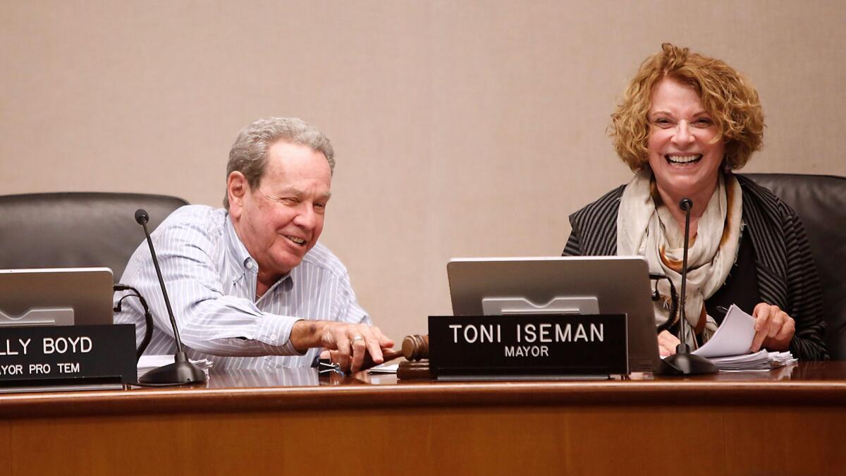 The Laguna Beach City Council appointed Kelly Boyd, left, as mayor for the next year. Toni Iseman was mayor for the past year.