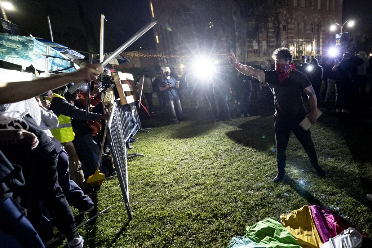 Counterprotesters attack a pro-Palestinian encampment at UCLA. 