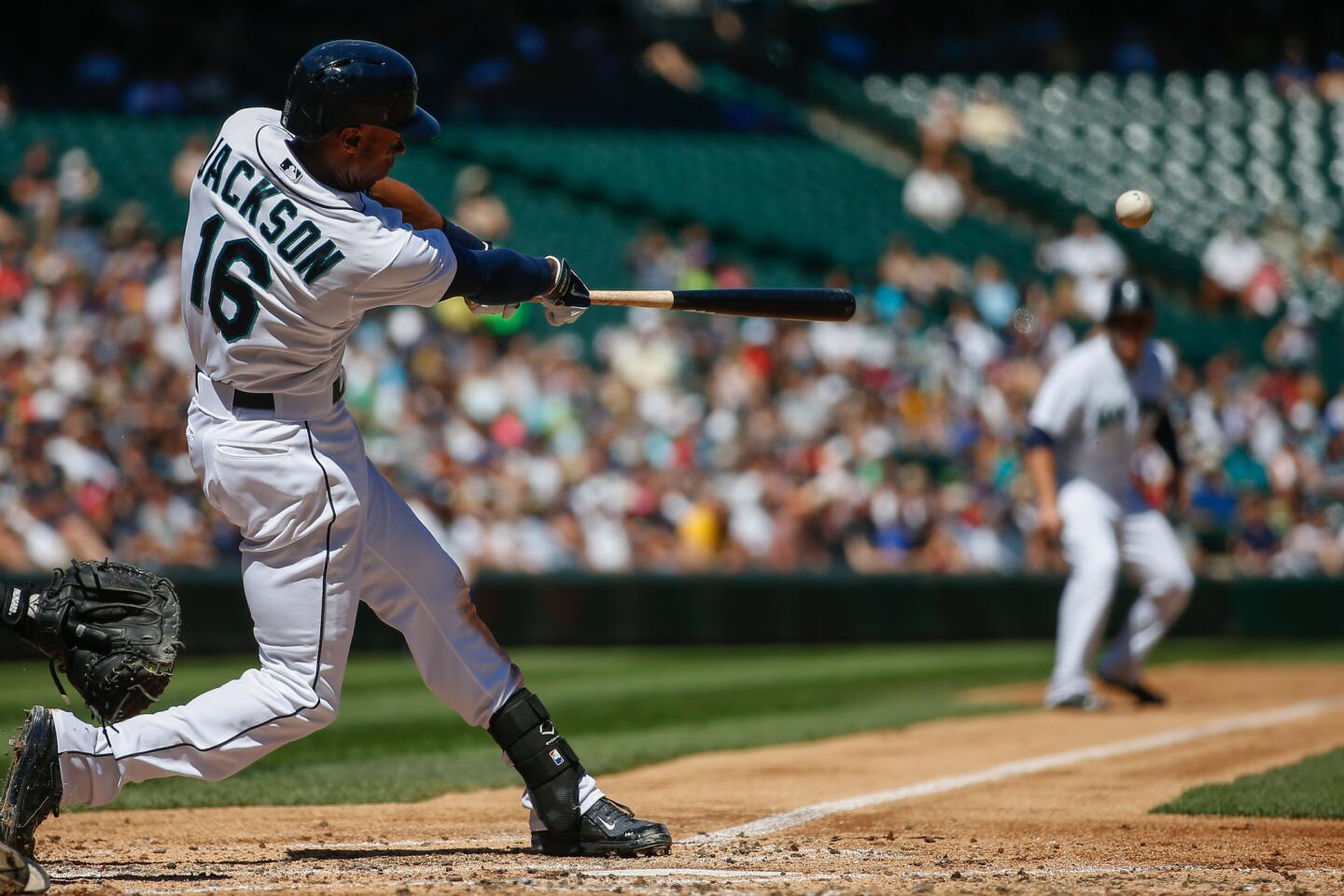 The Mariners' Austin Jackson hits a three-run double in the second inning.