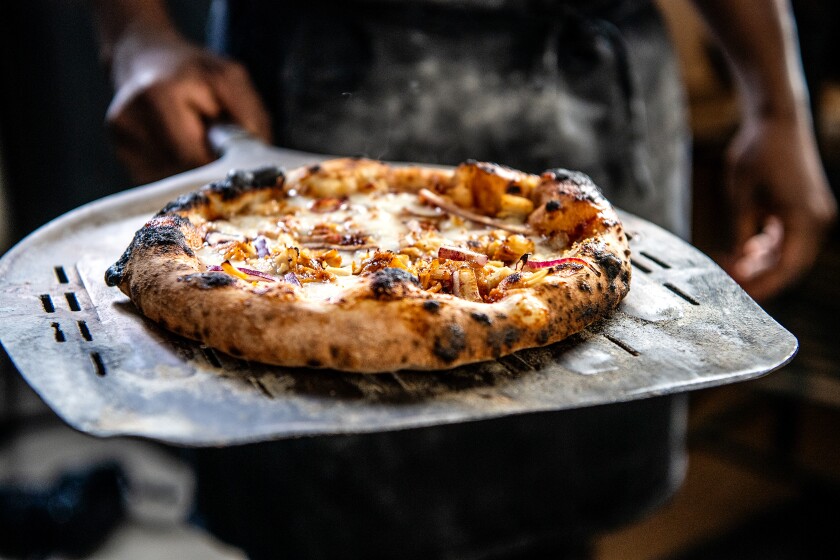 A close-up of a barbecue chicken pizza.