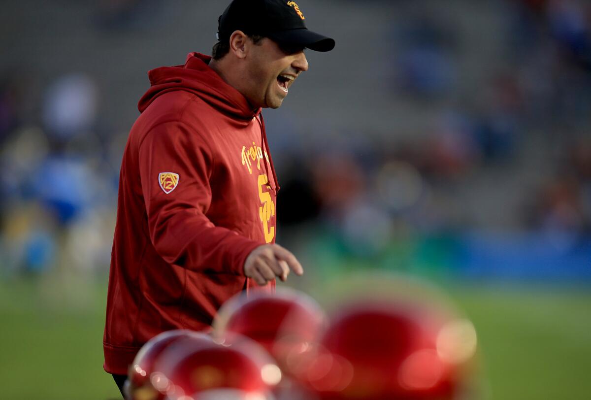 USC Coach Steve Sarkisian fires up his team before playing UCLA back in November.