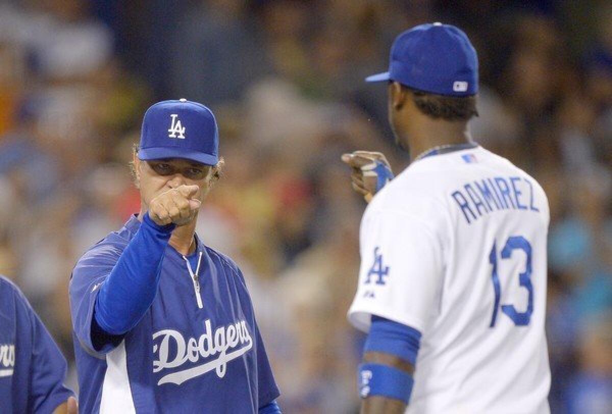 Don Mattingly points at Hanley Ramirez following the Dodgers' victory over the Boston Red Sox, 2-0, on Friday.