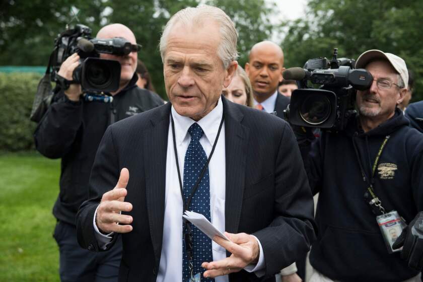 (FILES) In this file photo taken on June 4, 2018 White House Director of Trade Policy Peter Navarro (C) dodges the press after speaking on Fox News at the White House in Washington, DC. A senior aide to US President Donald Trump apologized June 12, 2018 for saying there was a "special place in hell" for Canadian Prime Minister Justin Trudeau, following the acrimonious Group of Seven summit."Let me correct a mistake I made," White House economic advisor Peter Navarro was quoted as saying at a Washington event organized by The Wall Street Journal."I used language that was inappropriate," he said, according to Journal reporters. "I used language that was inappropriate," he said, according to Journal reporters. / AFP PHOTO / JIM WATSONJIM WATSON/AFP/Getty Images ** OUTS - ELSENT, FPG, CM - OUTS * NM, PH, VA if sourced by CT, LA or MoD **