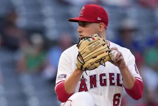 Los Angeles Angels starting pitcher Samuel Aldegheri prepares to throw to the plate.