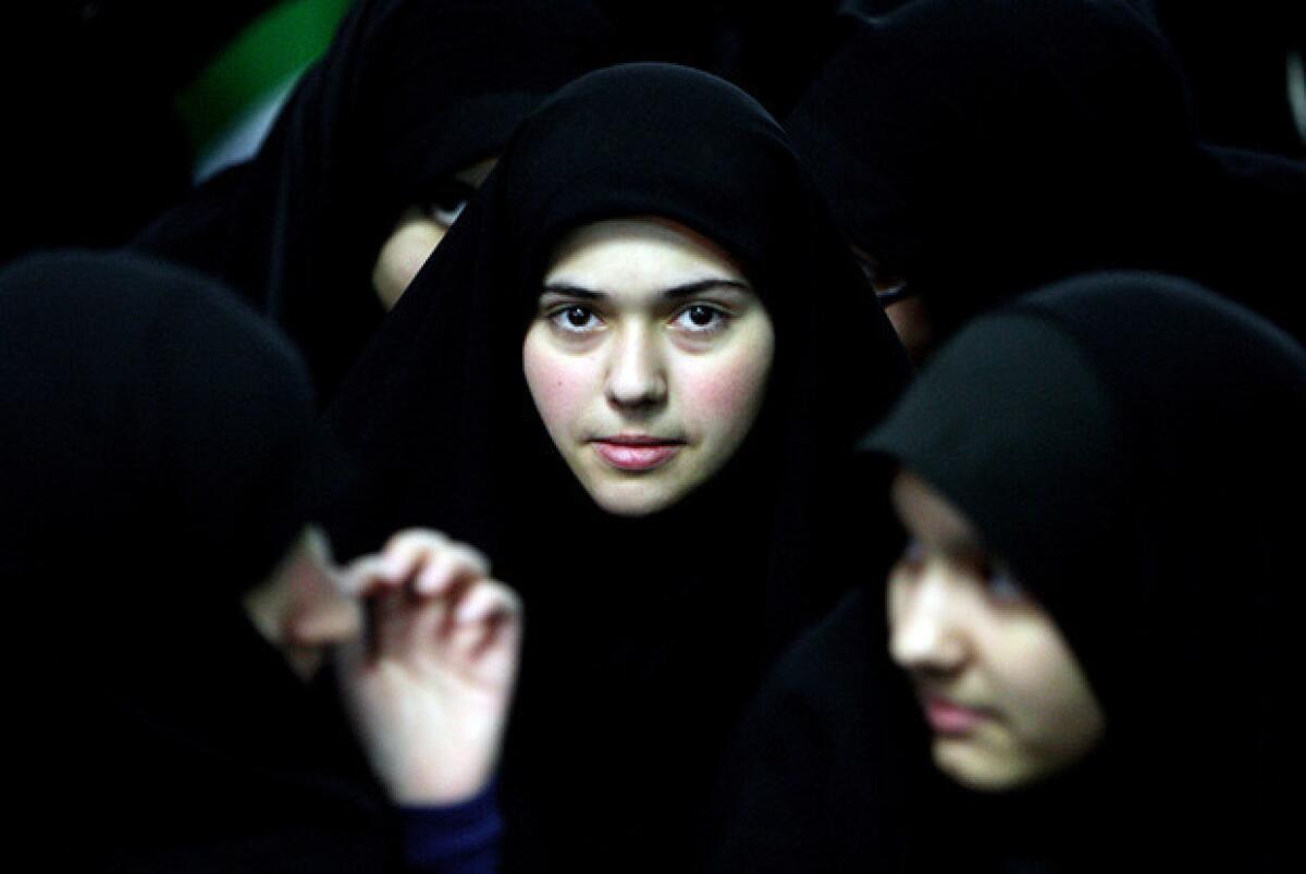 Iranian women attend a ceremony marking the 33th anniversary of Ayatollah Ruhollah Khomeini's return from exile at Khomeini's mausoleum in Tehran on February 1, 2012. Bells chimed across Iran to mark Khomeini's return from exile in 1979, the trigger for a revolution which spawned an Islamic state now engulfed in a deep political crisis. AFP PHOTO/ATTA KENARE (Photo credit should read ATTA KENARE/AFP/Getty Images)