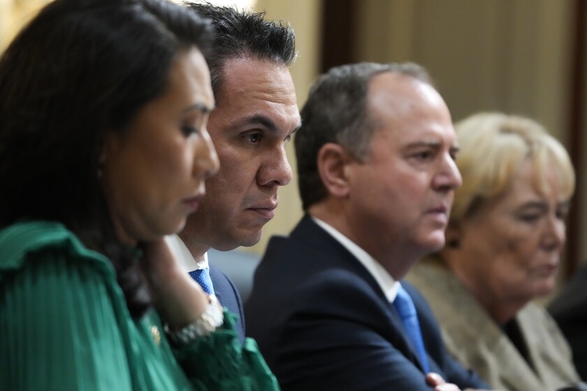 Four members of the House Jan. 6 committee listening during a hearing.