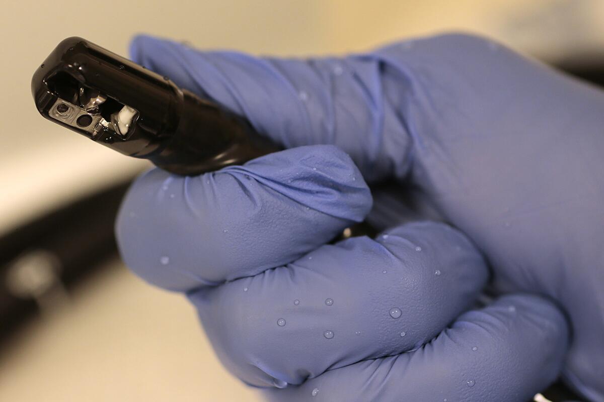 An Olympus duodenoscope is cleaned in the GI unit at USC Medical Center. (Robert Gauthier / Los Angeles Times)