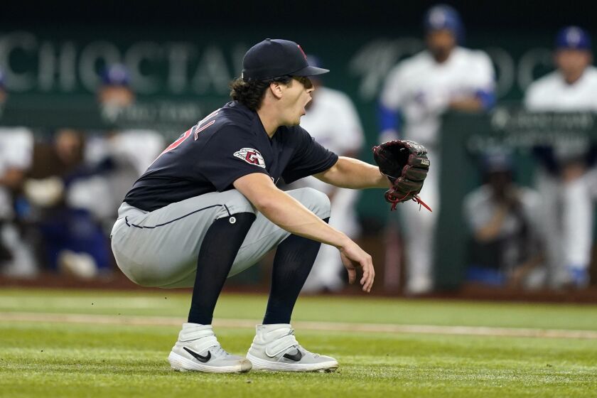Cleveland Guardians starting pitcher Cal Quantrill reacts to a third base umpire call during an at-bat by Texas Rangers' Josh Smith in the sixth inning of a baseball game in Arlington, Texas, Saturday, Sept. 24, 2022. (AP Photo/Tony Gutierrez)