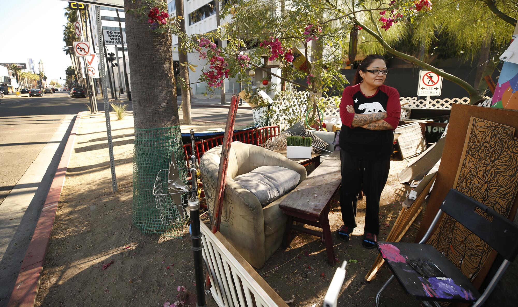 Rochelle Begaye in her complex stitched together with plywood, bed frames, and various fencing materials 