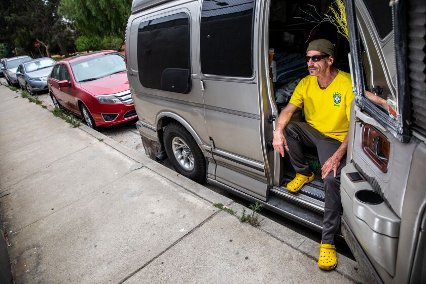 Hermosa Beach, CA - June 28: Scott Cooper is photographed sitting in the van he lives in along Ardmore Avenue in Hermosa Beach, CA, Tuesday, June 28, 2022. Cooper, who has health issues, including having suffered a heart attack, had been part of "Project Room Key," and says he lost his housing voucher for a hotel in nearby Lawndale, forcing him to live in his van for the last five days and foreseeable future. (Jay L. Clendenin / Los Angeles Times)