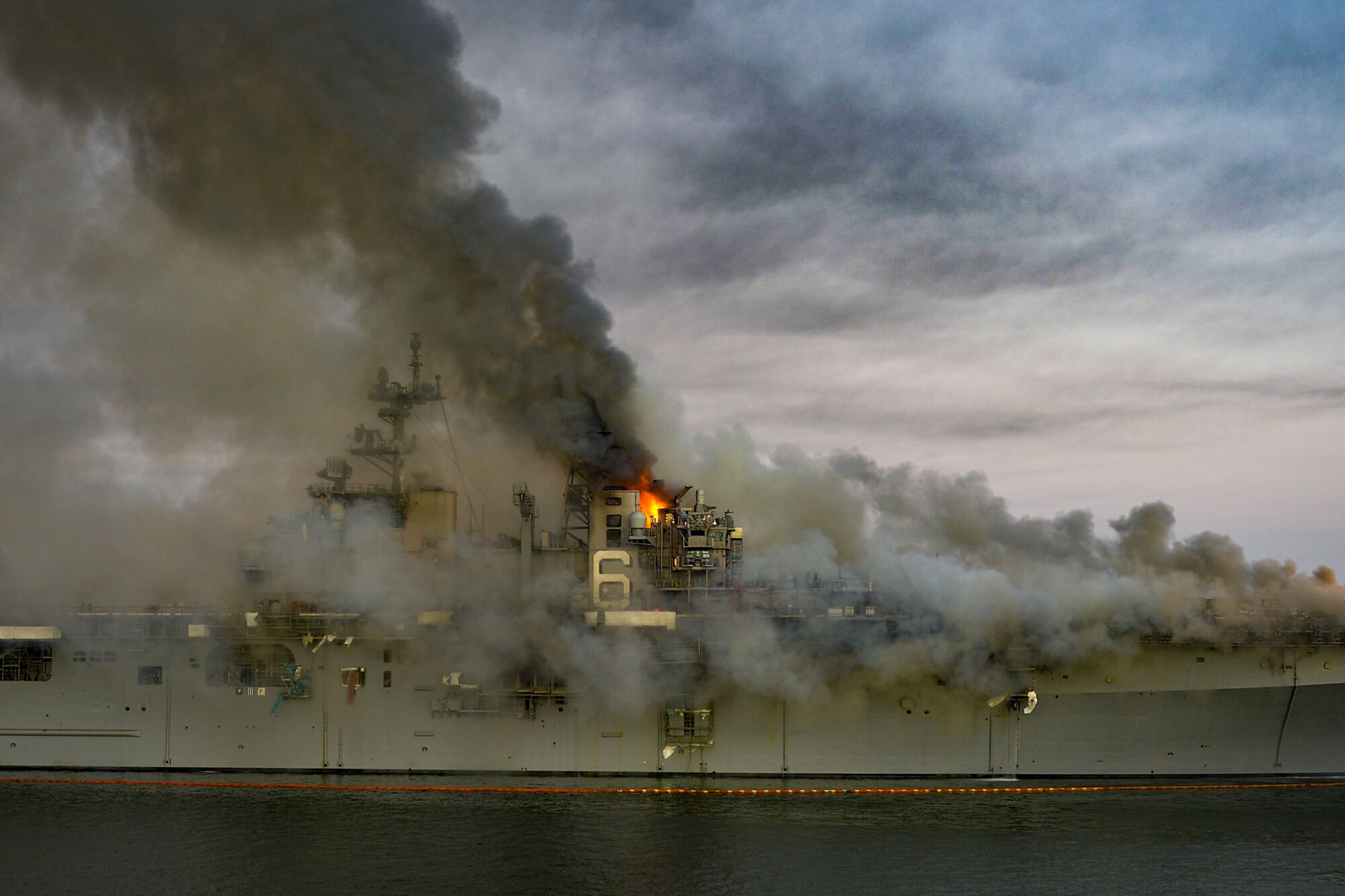 A fire continues to be fought into the evening on board the amphibious assault ship USS Bonhomme Richard.