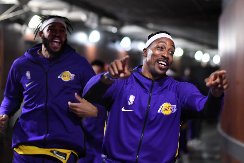LOS ANGELES, CALIFORNIA JANUARY 7, 2020-Lakers Dwight Howard leads his teamates to the court before a game with the Knicks at the Staples Center Tuesday. (Wally Skalij/Los Angerles Times)