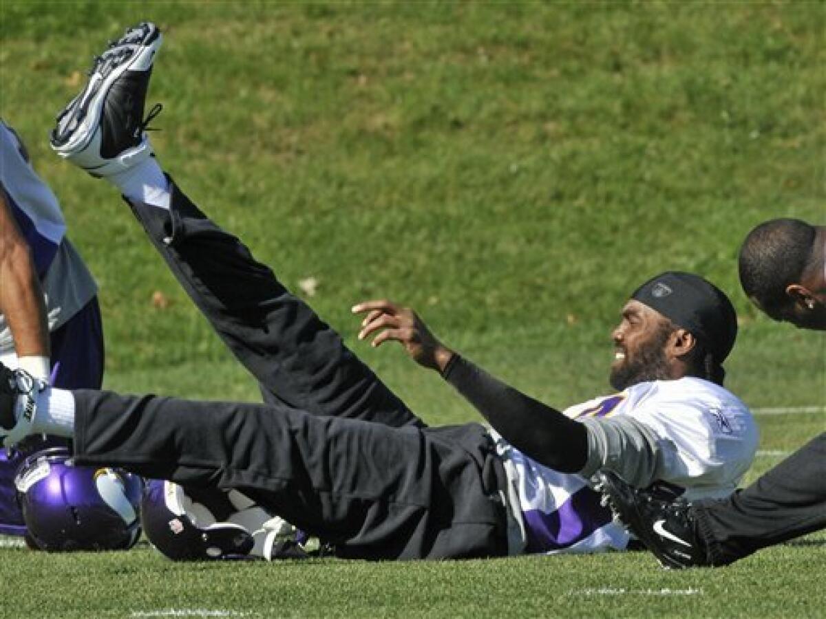 Wide receiver Randy Moss of the Minnesota Vikings smiles as he