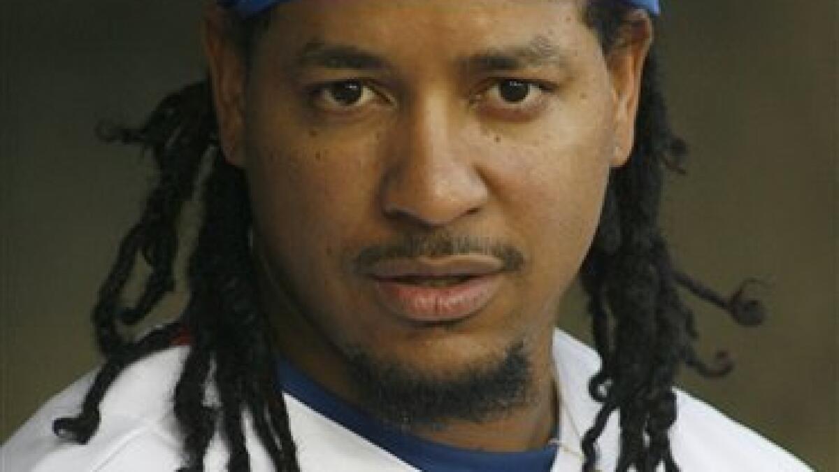 Boston Red Sox Manny Ramirez, with his hair in dread locks, is shown during  batting practice before his team's spring training baseball game against  the Baltimore Orioles in Ft. Lauderdale, Fla., Wednesday