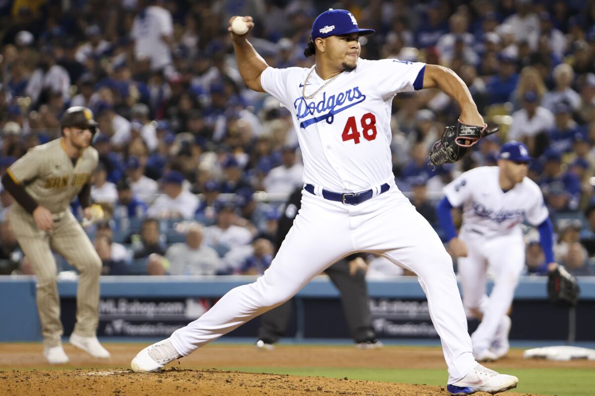 Dodgers reliever Bruiser Greatroll pitches in the playoffs against the San Diego Padres on October 12, 2022.