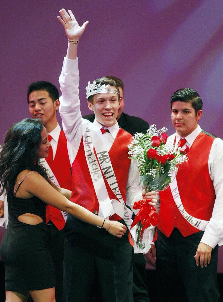 Colin Sneddon waves to the audience after being crowned Mr. Nitro at the Mr. Nitro Pageant in the Performing Arts Center at Glendale High School in Glendale on Wednesday, January 22, 2014. Six male students competed in three overall categories including tuxedo, swimsuit, and talent. Colin Sneddon was crowned Mr. Nitro after a tie-breaker round. (Tim Berger/Staff Photographer)