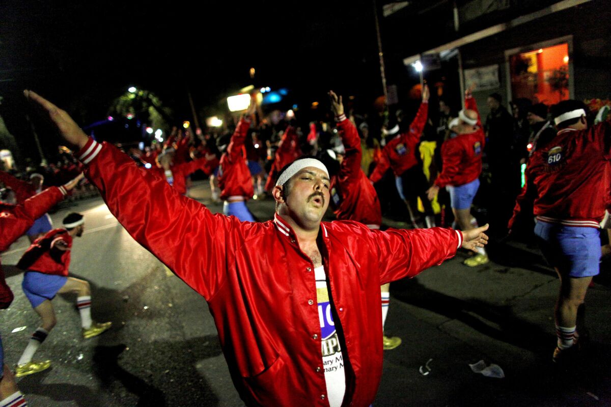 Daryl McGill dances with fellow 610 Stompers while marching with the Krewe of Nyx in New Orleans. The Stompers' motto: "Ordinary Men. Extraordinary Moves."