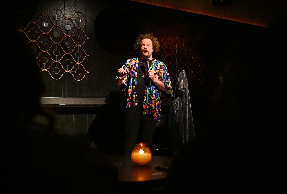 Comedian Alex Hooper performs at Club Tee Gee in Los Angeles.