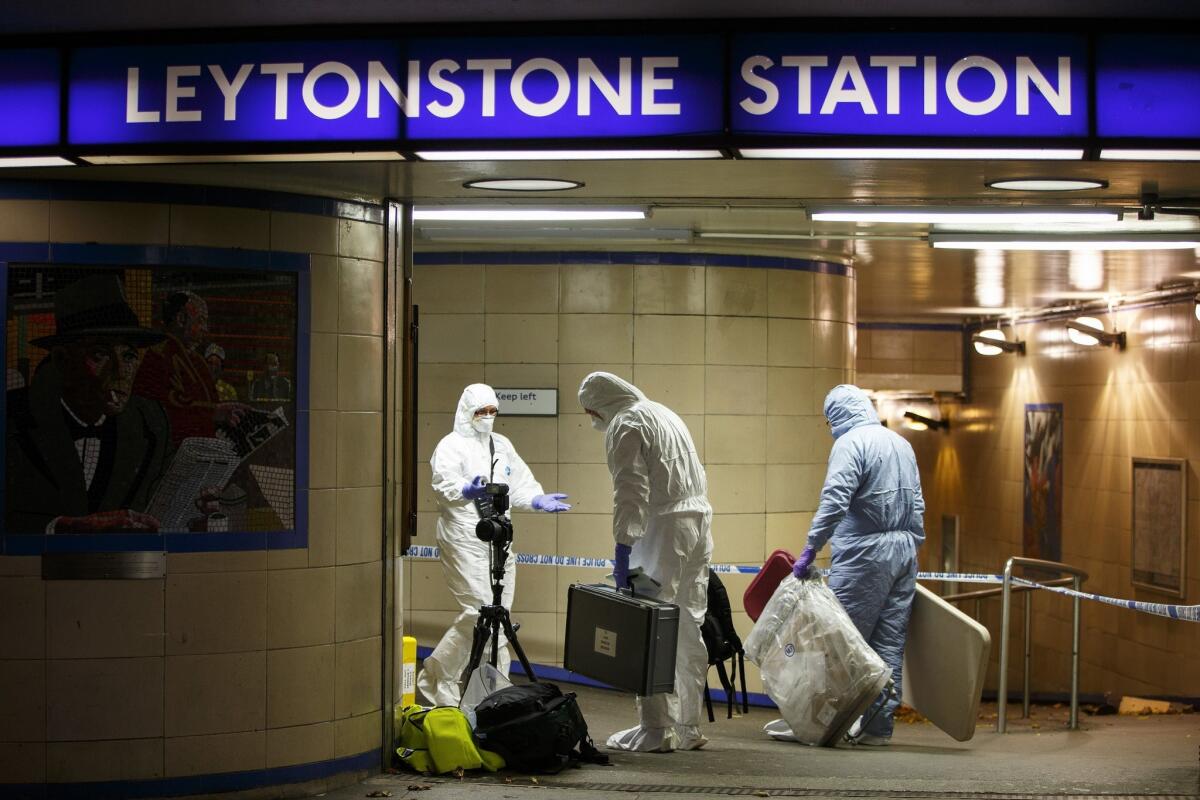 Crime scene investigators collect evidence at Leytonstone tube station in east London. (Getty Images)