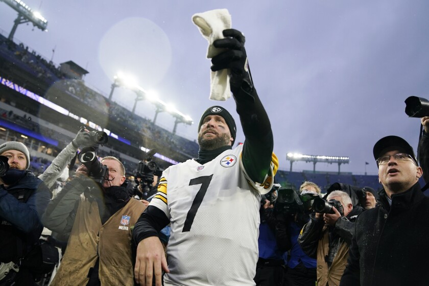 Pittsburgh Steelers quarterback Ben Roethlisberger hands a spectator a towel as he walks off the field after an NFL football game against the Baltimore Ravens, Sunday, Jan. 9, 2022, in Baltimore. The Steelers won 16-13. (AP Photo/Evan Vucci)