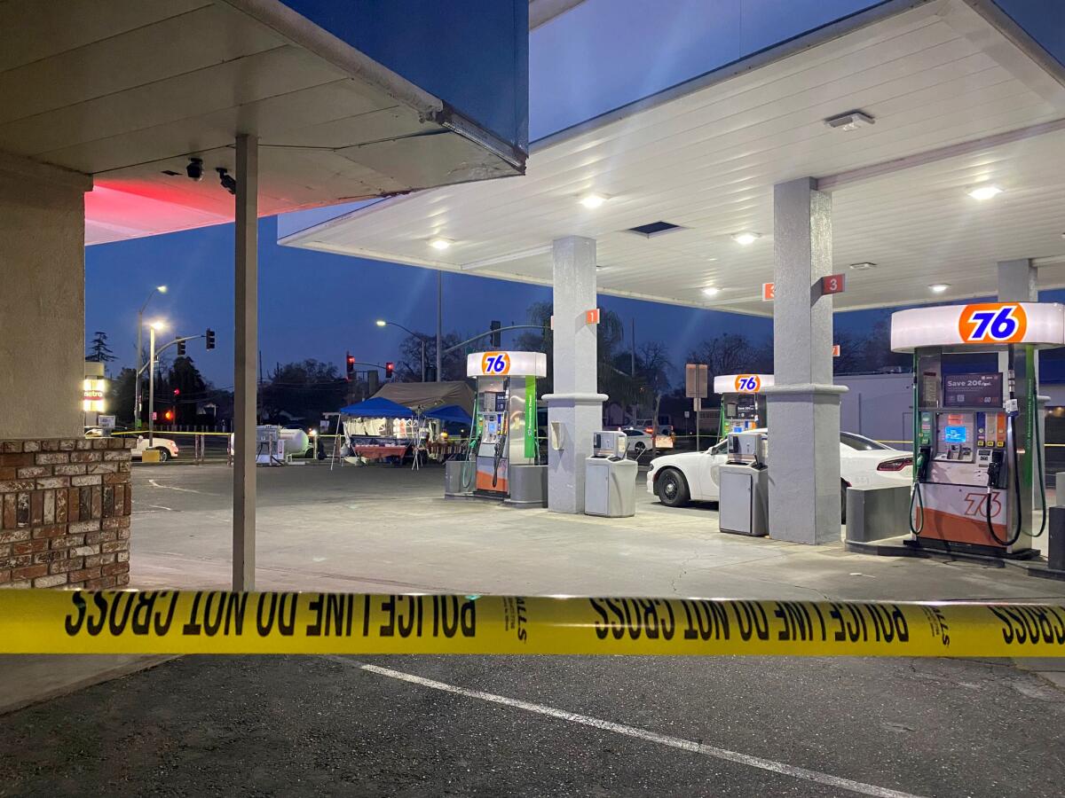 Police tape at a gas station.