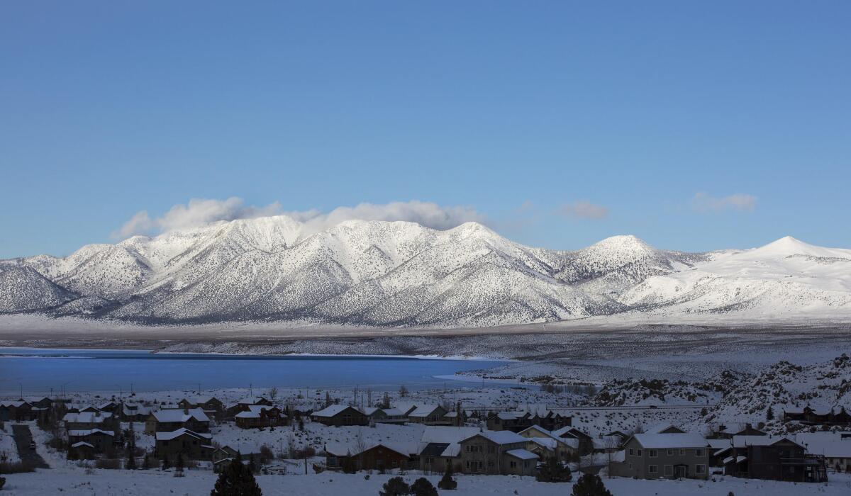 Snow-covered mountains rise above Crowley Lake in the eastern Sierra Nevada.