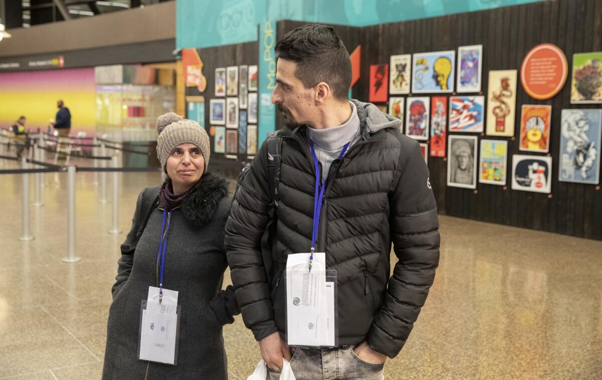 Iranian refugees Sirvan Moradi and his aunt, Saltanat Moradi, arrive at the airport in Seattle to start their new life in the United States.