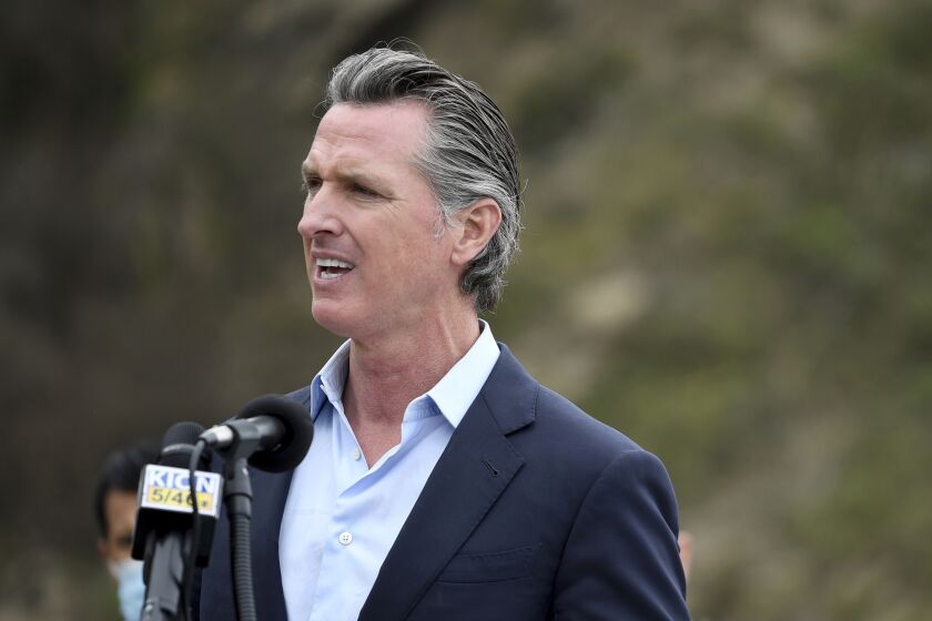 FILE - In this April 23, 2021, file photo, California Gov. Gavin Newsom speaks during a press conference in Big Sur, Calif. California on Saturday is increasing early release credits for tens of thousands of inmates including violent and repeat felons as it further trims the population of what once was the nation's largest state correctional system. Officials announced in mid-April that they will close a second prison as a result of the dwindling population, fulfilling a promise by Newsom. (AP Photo/Nic Coury, File)