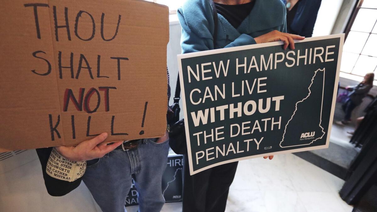 Protesters on Thursday prior to the New Hampshire legislature completing its override of a governor's veto and ending the death penalty.