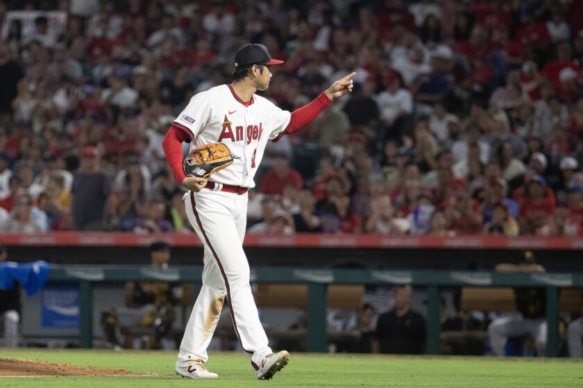 Anaheim, CA - July 21: Angels star starting pitcher, two-way player and designated hitter Shohei Ohtani leaves the mound and points to the crowd after pitching during a game with the Pirates at Angel Stadium in Anaheim Friday, July 21, 2023. (Allen J. Schaben / Los Angeles Times)