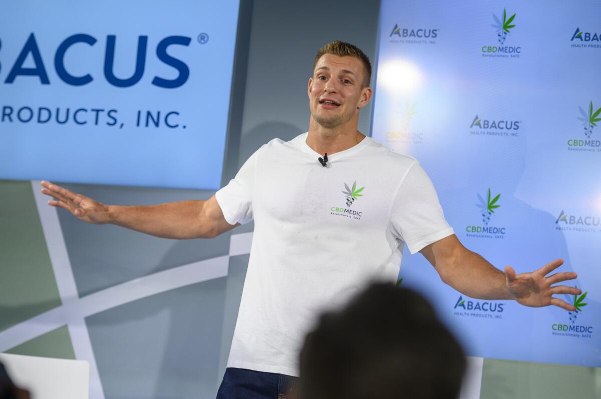 Former New England Patriots tight end Rob Gronkowski holds a news conference announcing his advocacy for CBD on Tuesday in New York.