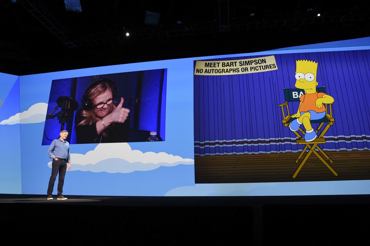 Adobe Executive Vice President Bryan Lamkintalks to cartoon character Bart Simpson during an Adobe event in November.