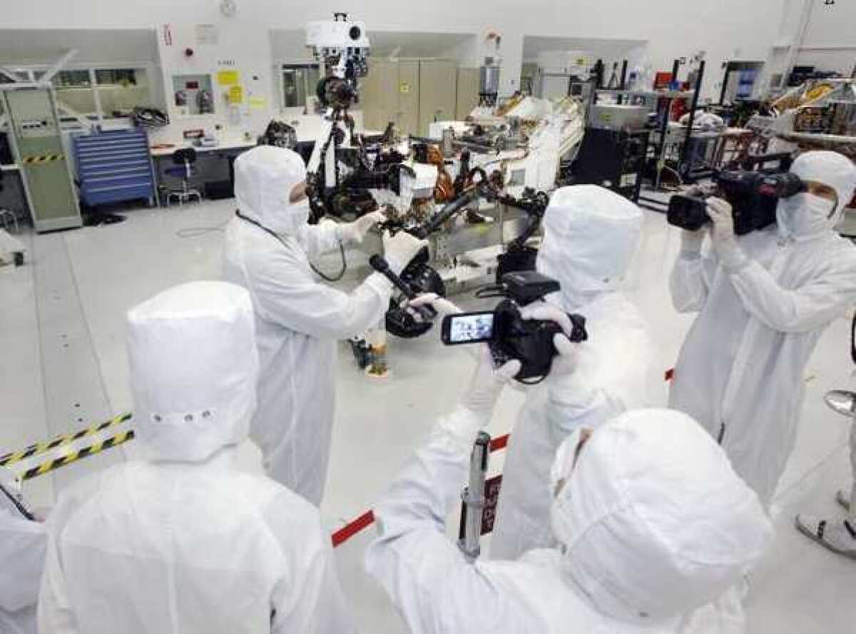 Curiosity was developed, built and assembled at the Jet Propulsion Laboratory in La Canada Flintridge. Here, scientists inspect the rover in JPL's Clean Room. JPL is expected to lead the operation on NASA's new rover mission.