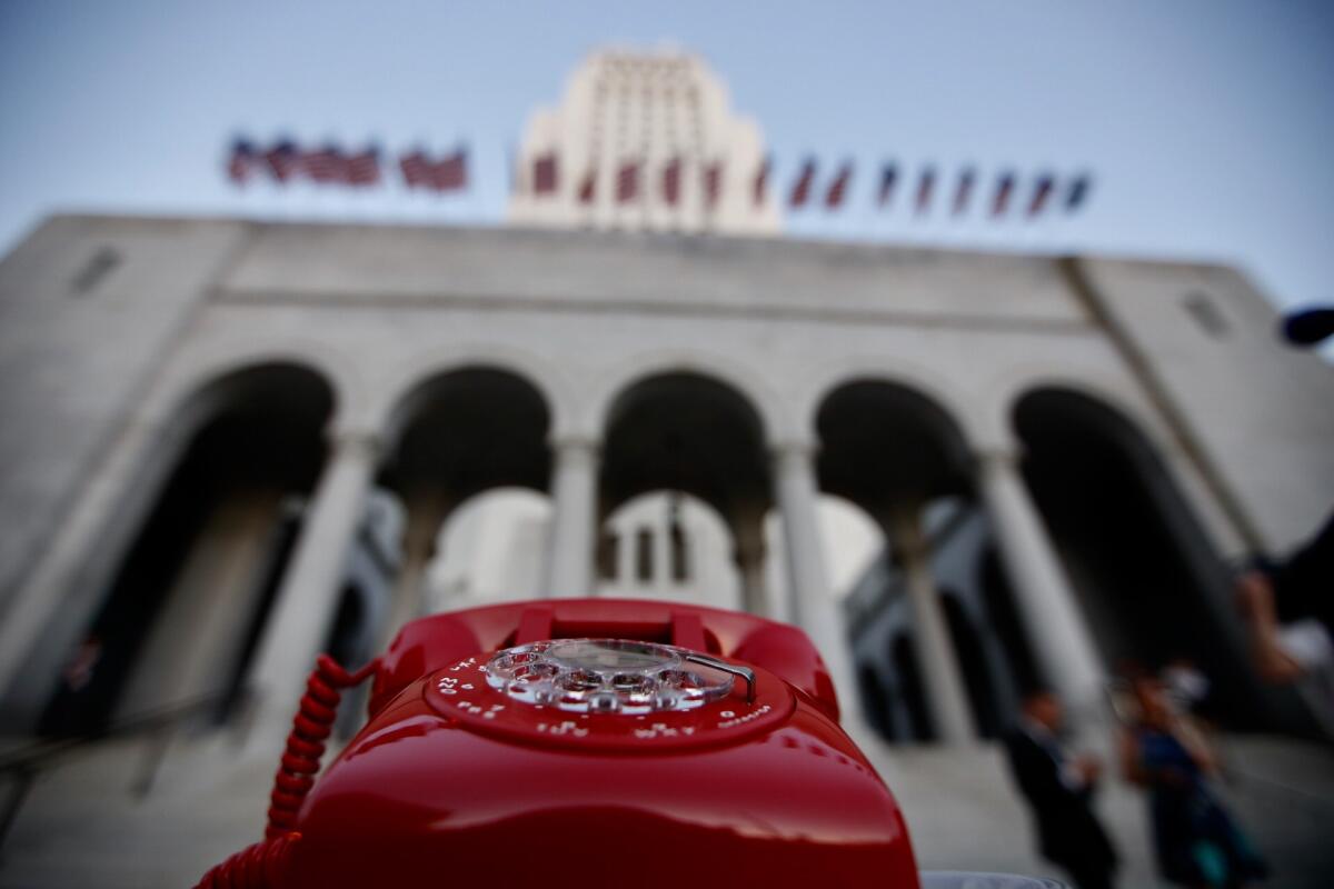 A Bat phone stand-in awaits the commissioner's call in front of L.A. City Hall during a tribute to Adam West on June 15.
