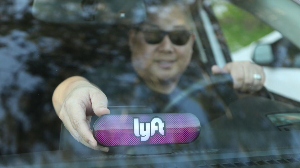 A Lyft driver in San Francisco gets ready to accept riders.